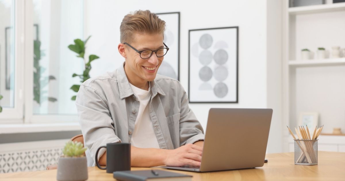 smiling man using internet in Vietnam