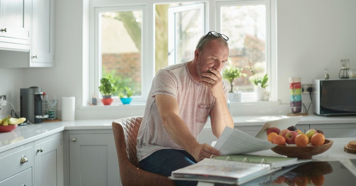 man comparing the cost of living in Barcelona and the USA