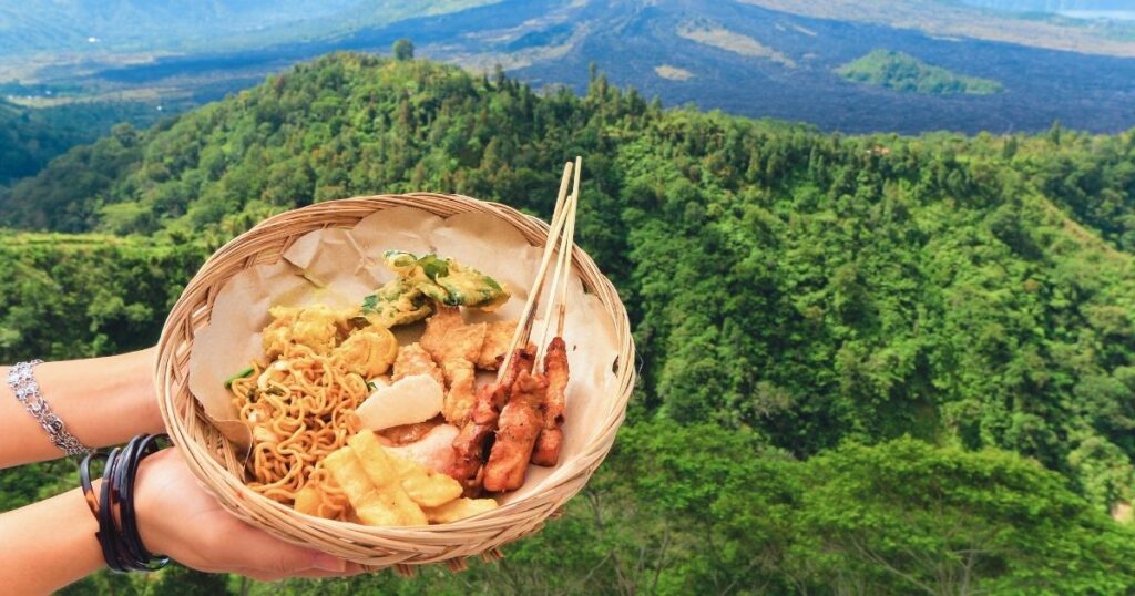 woman showing a typical Bali dish