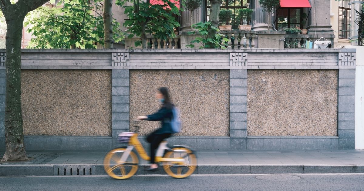 woman riding a rental bike in Barcelona