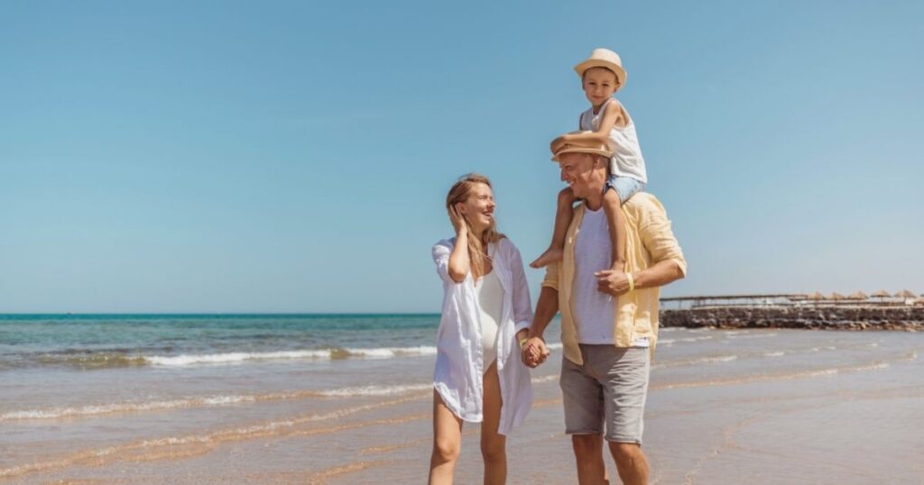 family with kids having fun in a Bali beach