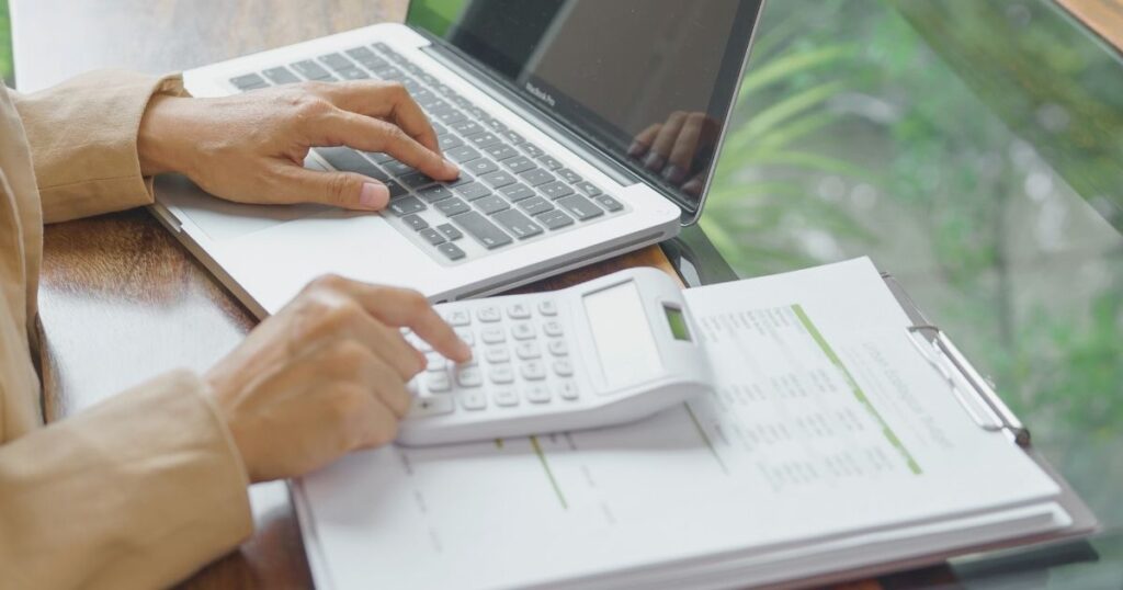 person calculating the financial aspects of driving in Sweden