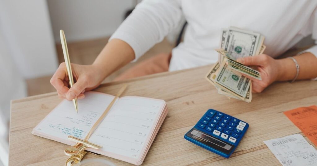 woman calculating costs of health insurance in South Africa