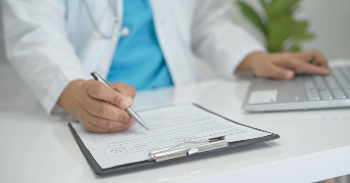 doctor filling forms of the health insurance in the Czech Republic