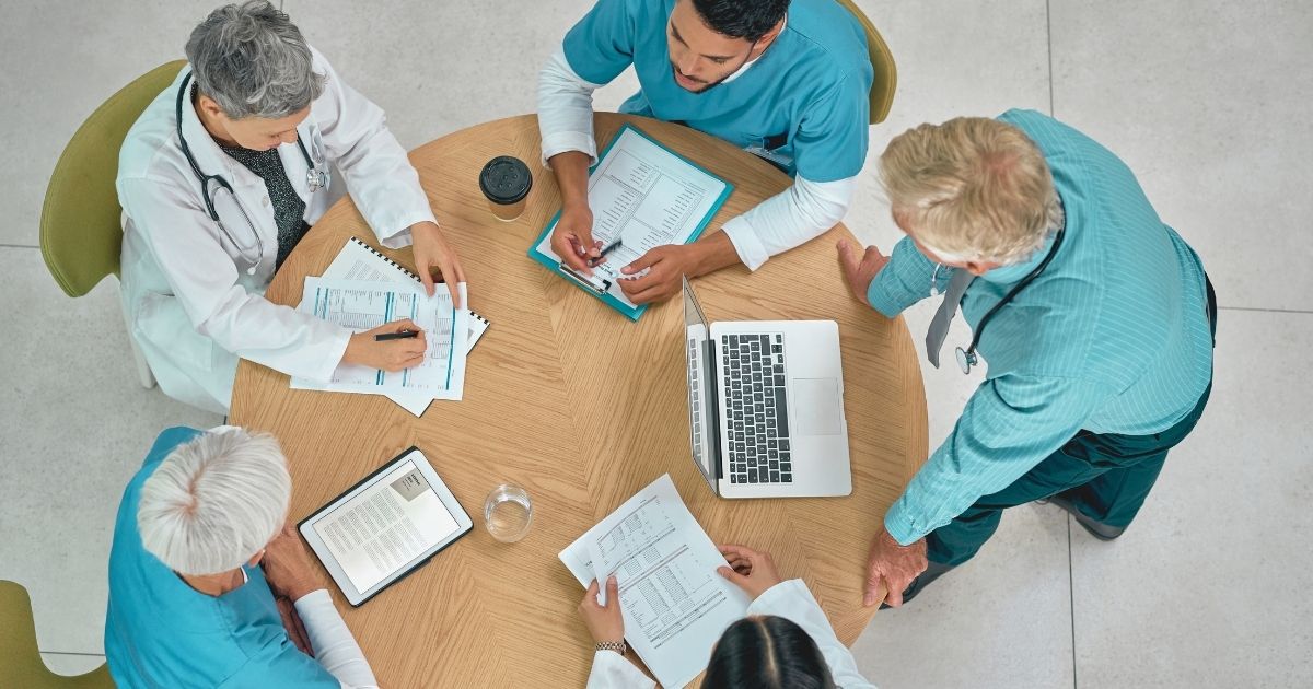 doctor checking the health insurance exclusions