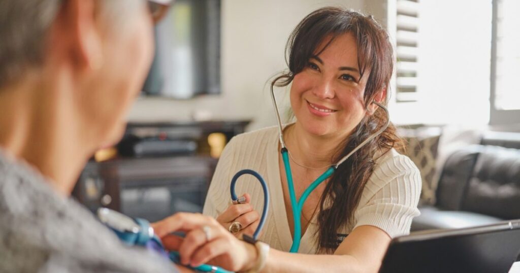 smiling doctor taking care of a retired patient 