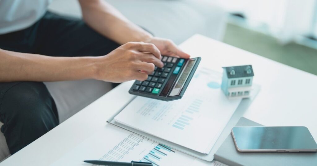 man calculating property taxes in Hungary