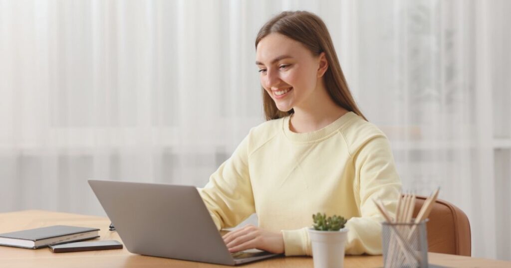 young woman using vpn in her laptop
