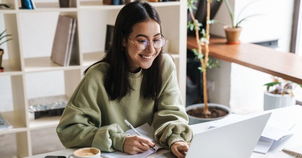 smiling woman doing homework with a vpn