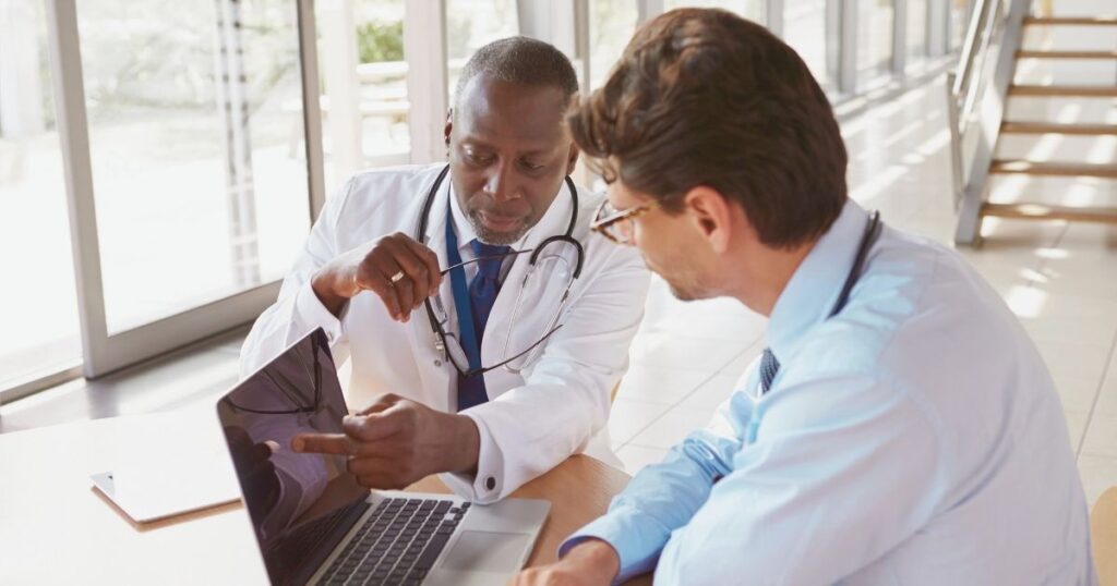 doctors talking about the health coverage exclusions